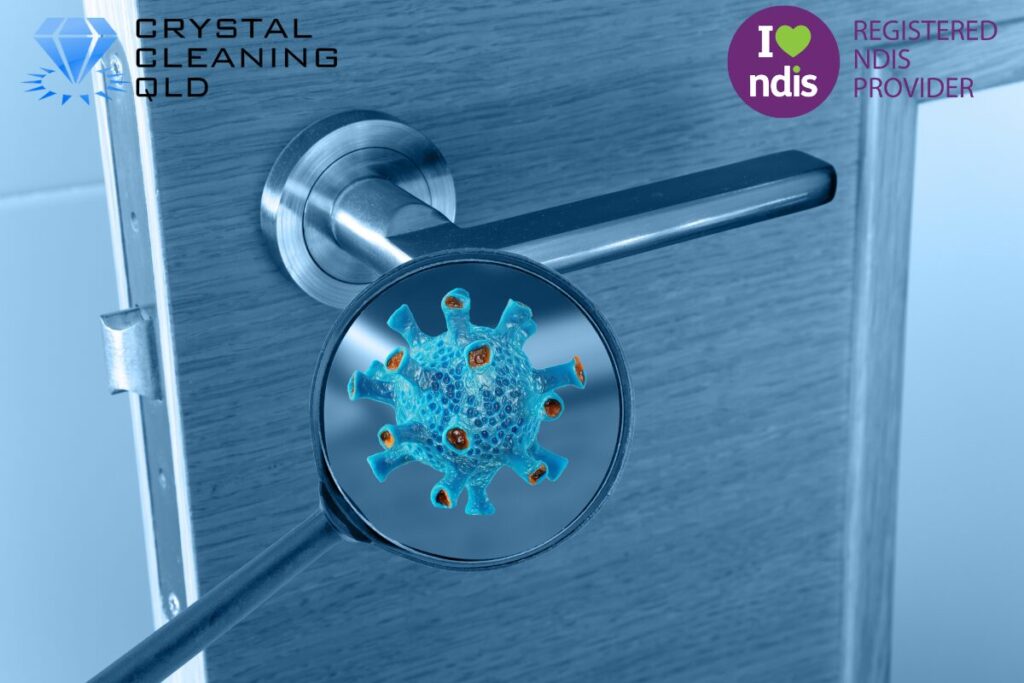 A close-up of a metal door handle with a blue tint, viewed through a magnifying glass that reveals a detailed 3D illustration of a virus cell, as shown in 名称未設定 (1200 x 800 px) (14).jpg. The Crystal Cleaning QLD and Registered NDIS Provider logos are placed in the upper corners to accompany the infection control guide on how to perfect cleaning & support easily.